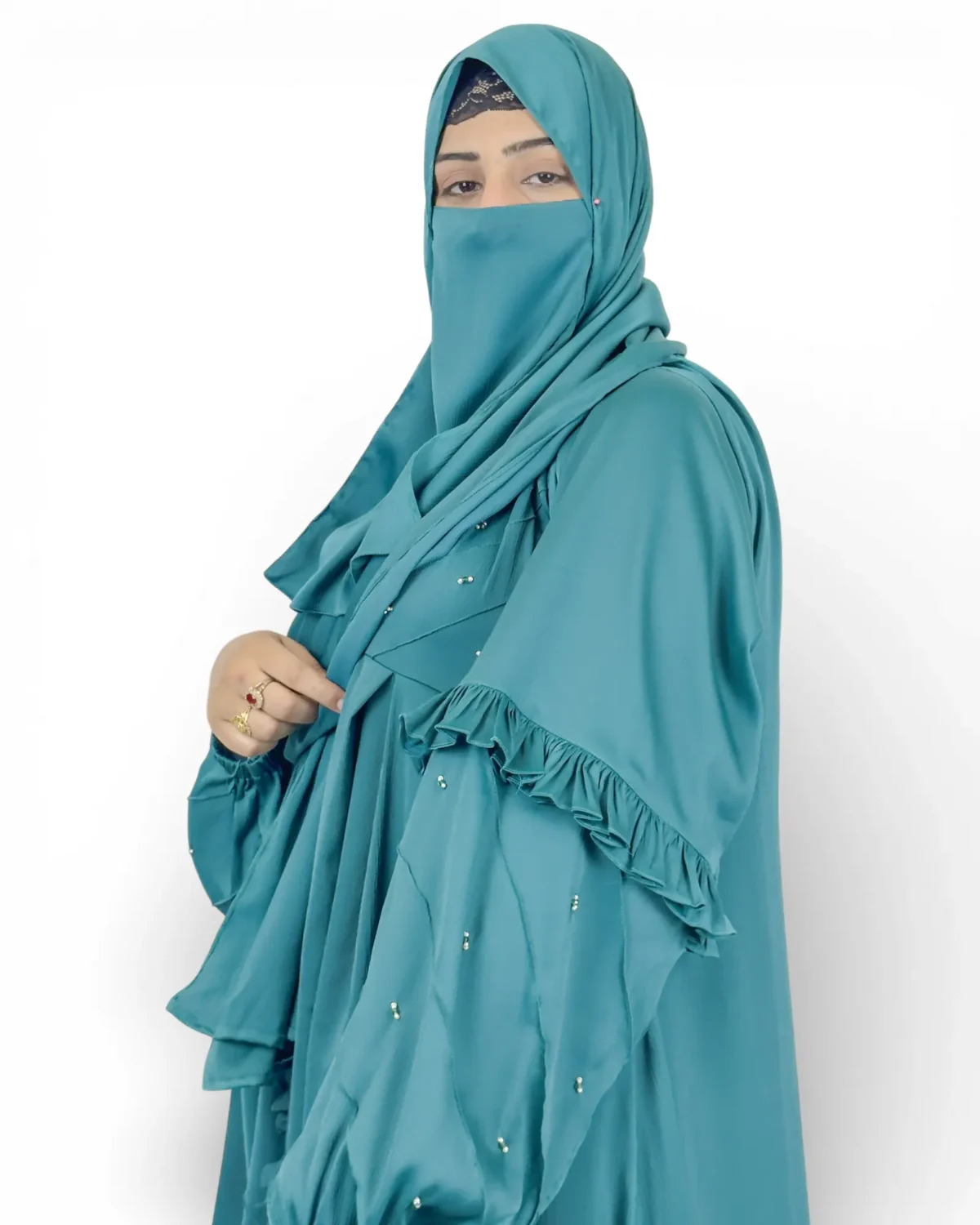 Ocean Lace abaya three-quarter front view with crystal embellishments and ruffle cuffs