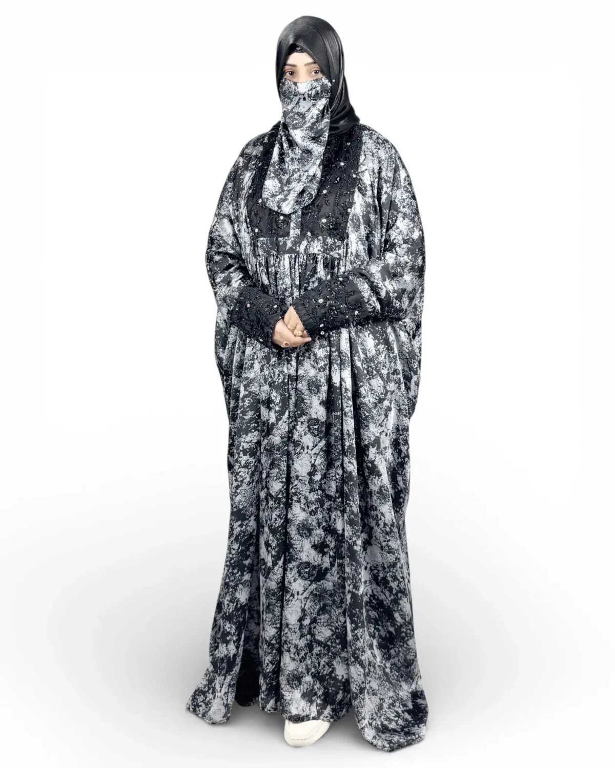 Midnight Snow abaya three-quarter front view with printed niqab and black hijab