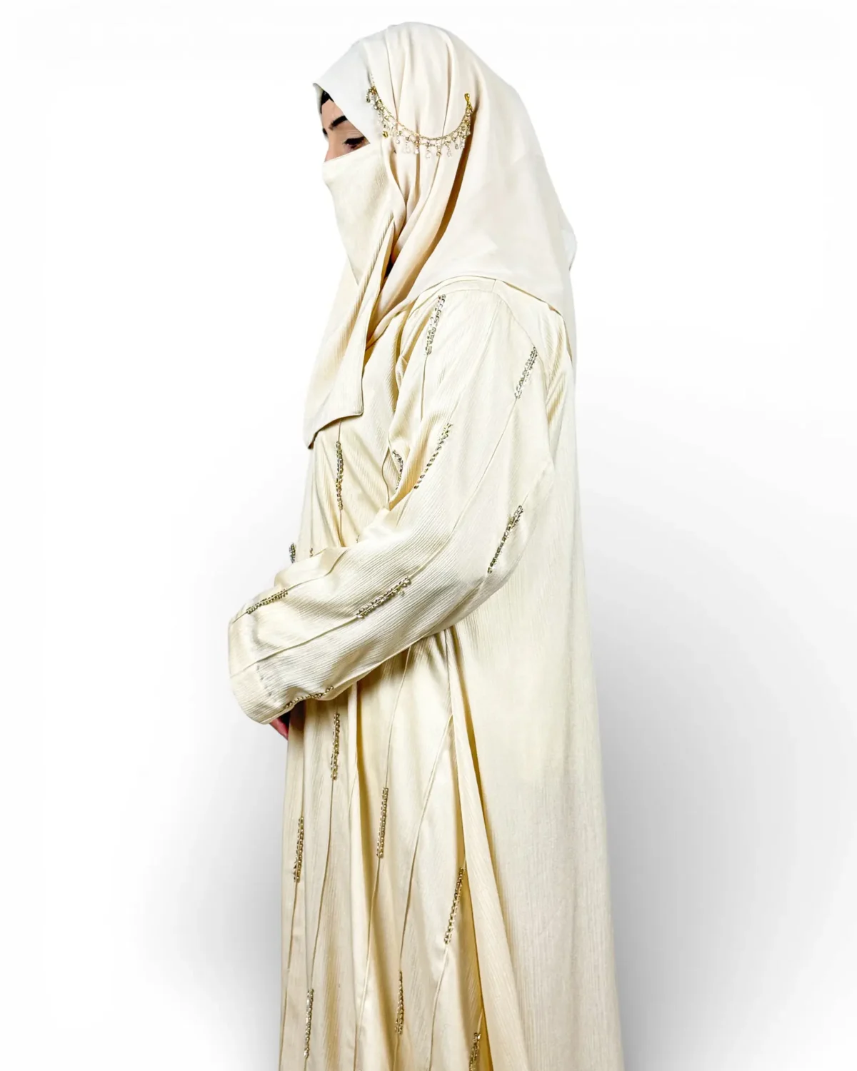 Royal Ivory ivory satin abaya side profile highlighting embroidered dash motifs on sleeves