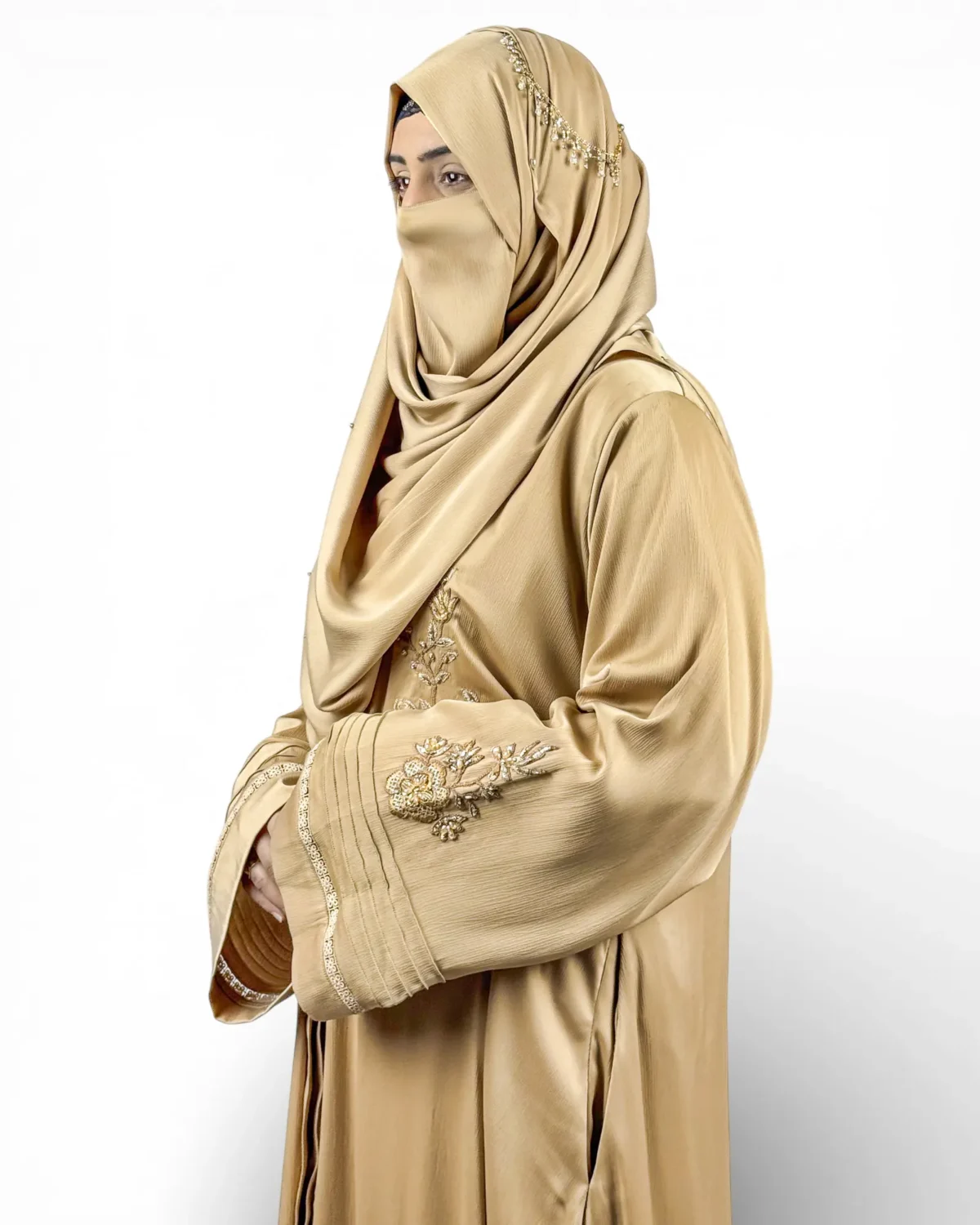 Aura golden abaya full length view showing embroidered sleeves and chest with matching hijab