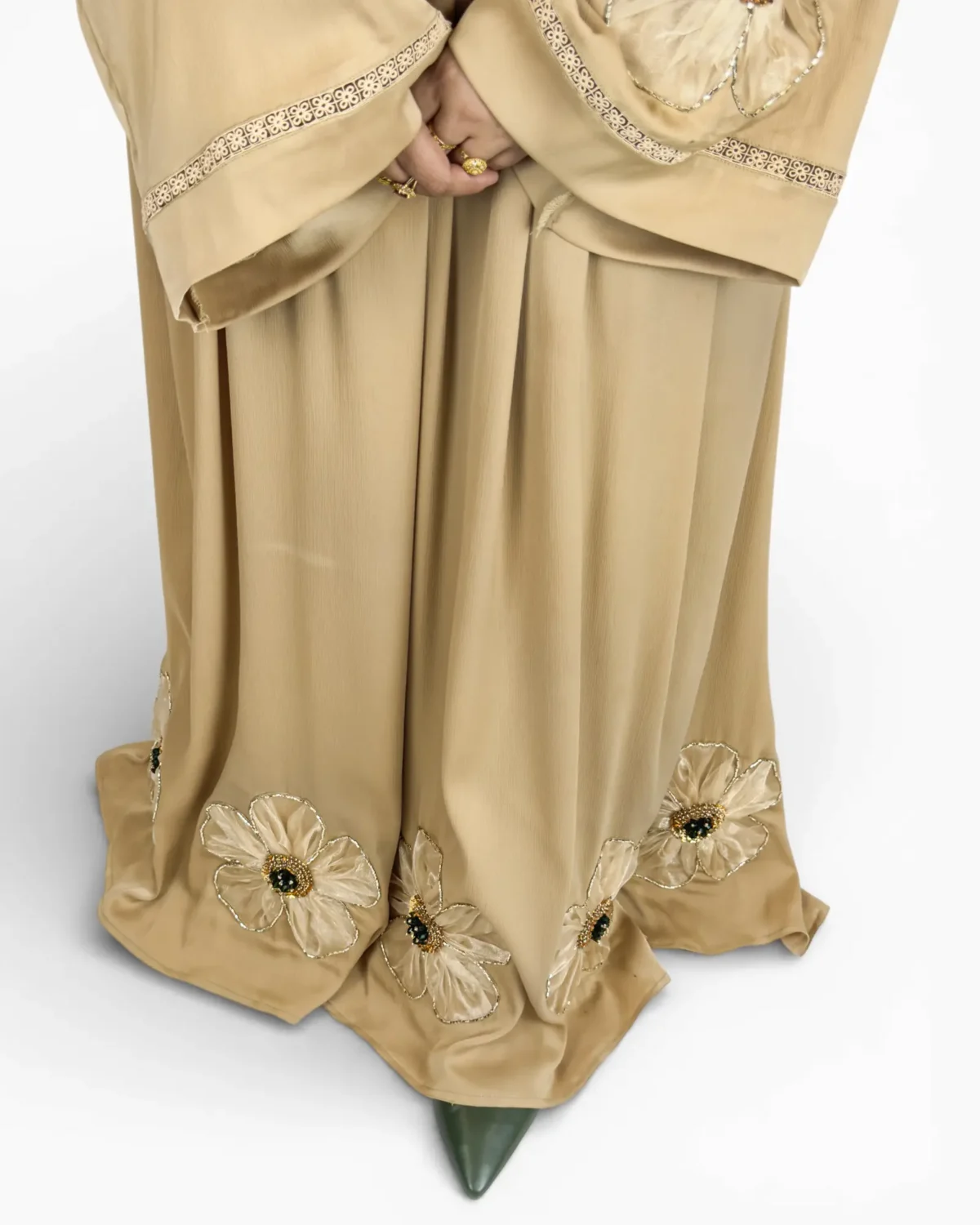 Golden Bloom champagne abaya showing large 3D satin flower appliqué at bodice