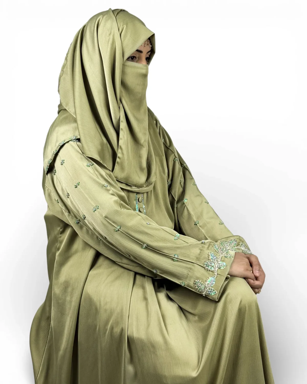 Olive Bloom green abaya detail of vine leaf and floral embroidery border at hem