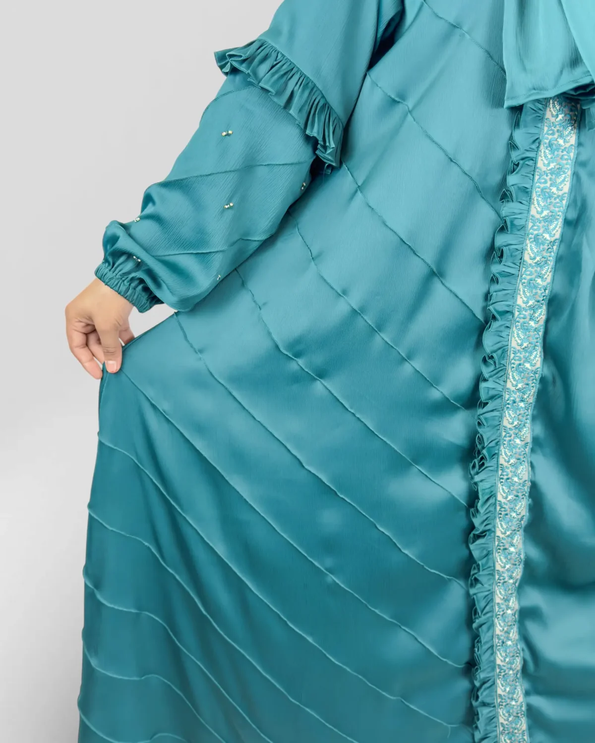 Ocean Lace abaya close-up of embroidered lace trim and crystal pearl accents