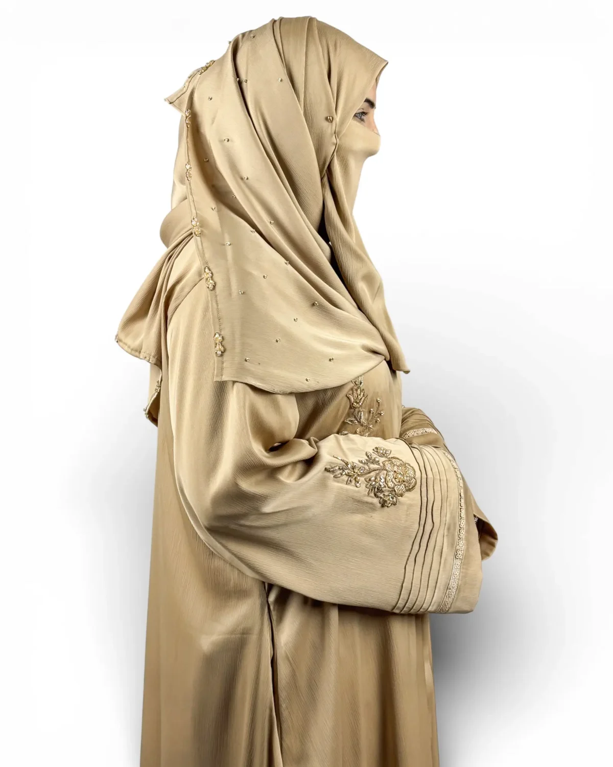 Aura camel gold abaya angled view with crystal-studded golden hijab scarf