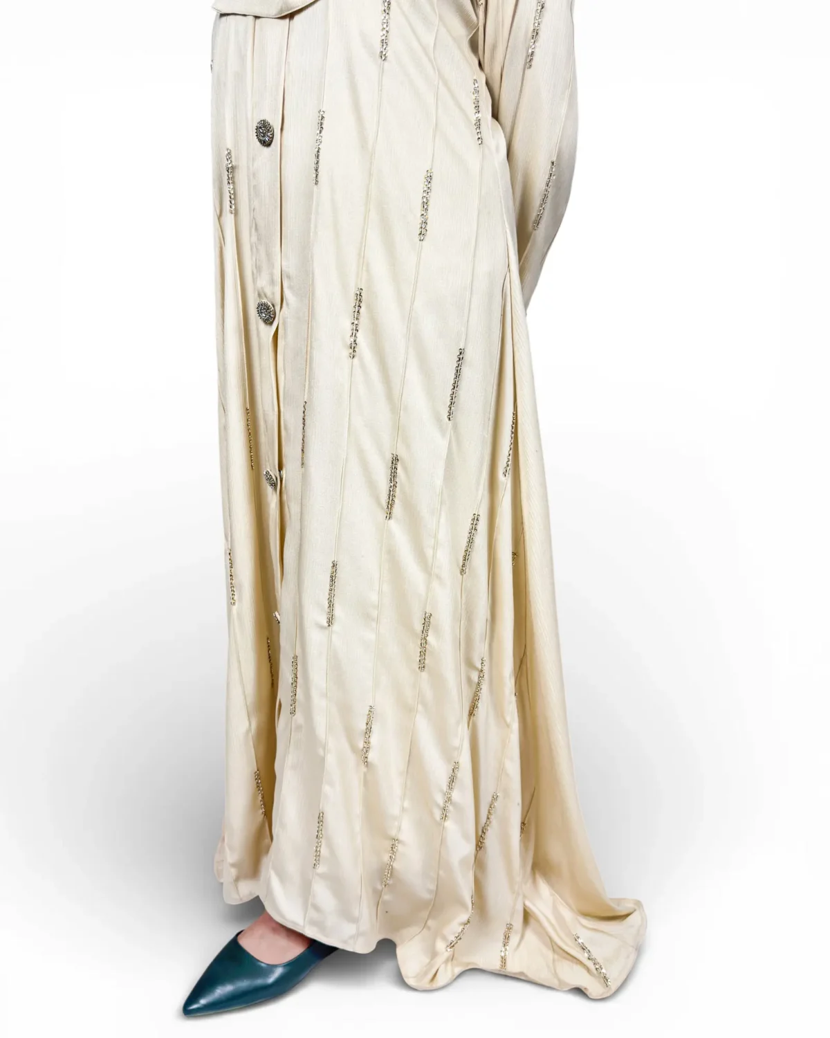 Royal Ivory cream satin abaya seated view with matching cream hijab and niqab