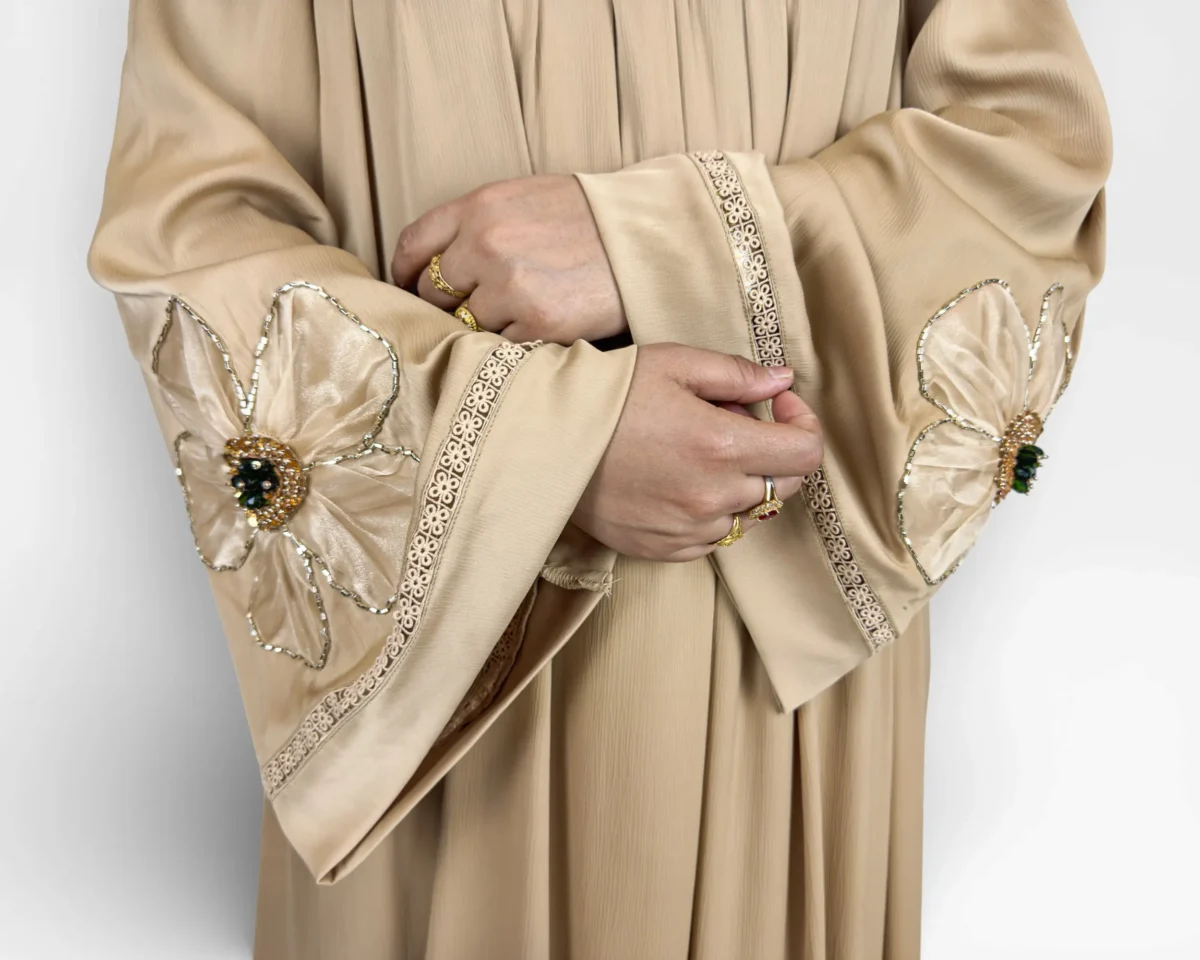 Golden Bloom satin abaya detail of gold floral scroll lace trim at sleeve edge