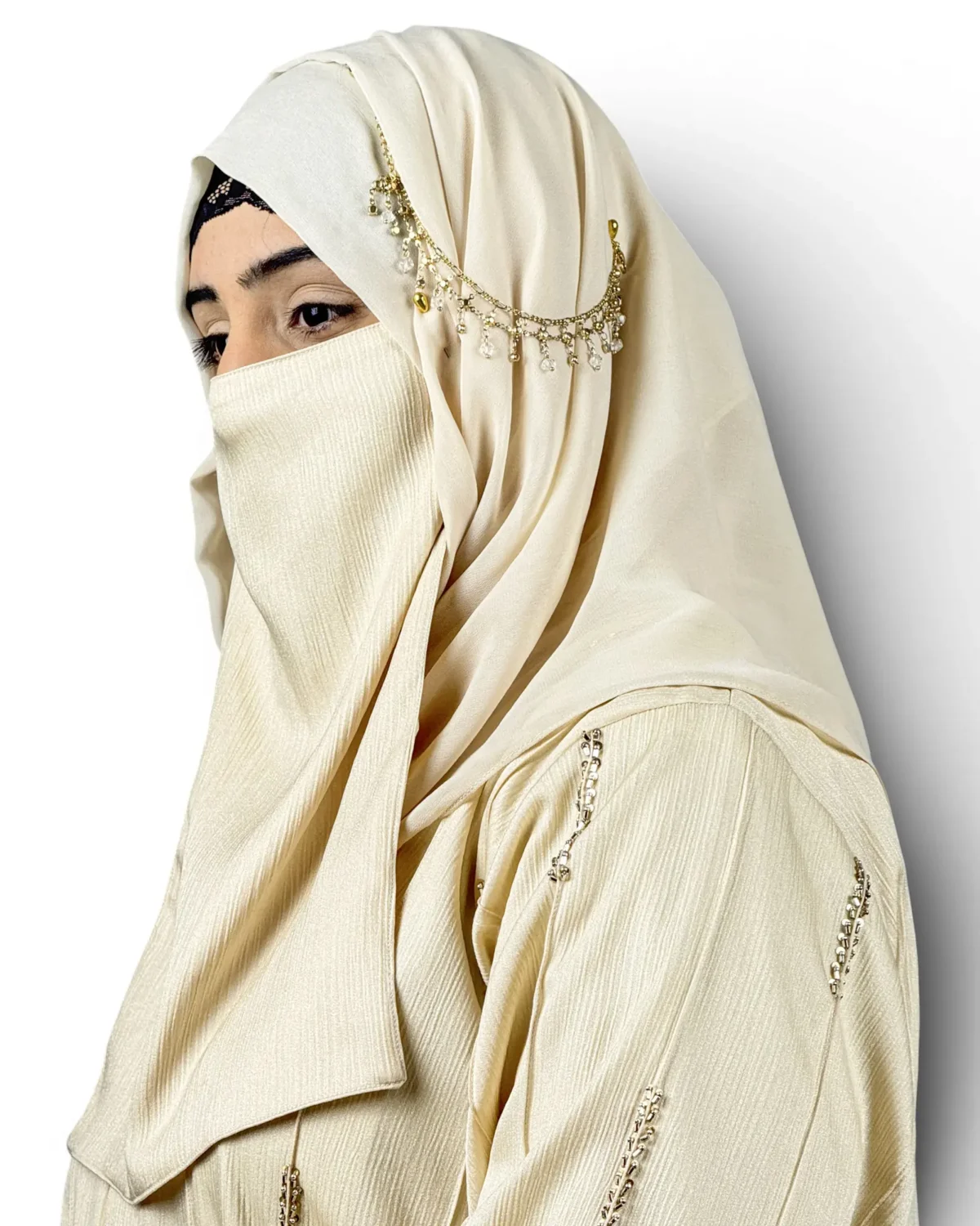 Royal Ivory cream abaya close-up of embroidered dash motifs and pintuck textured fabric