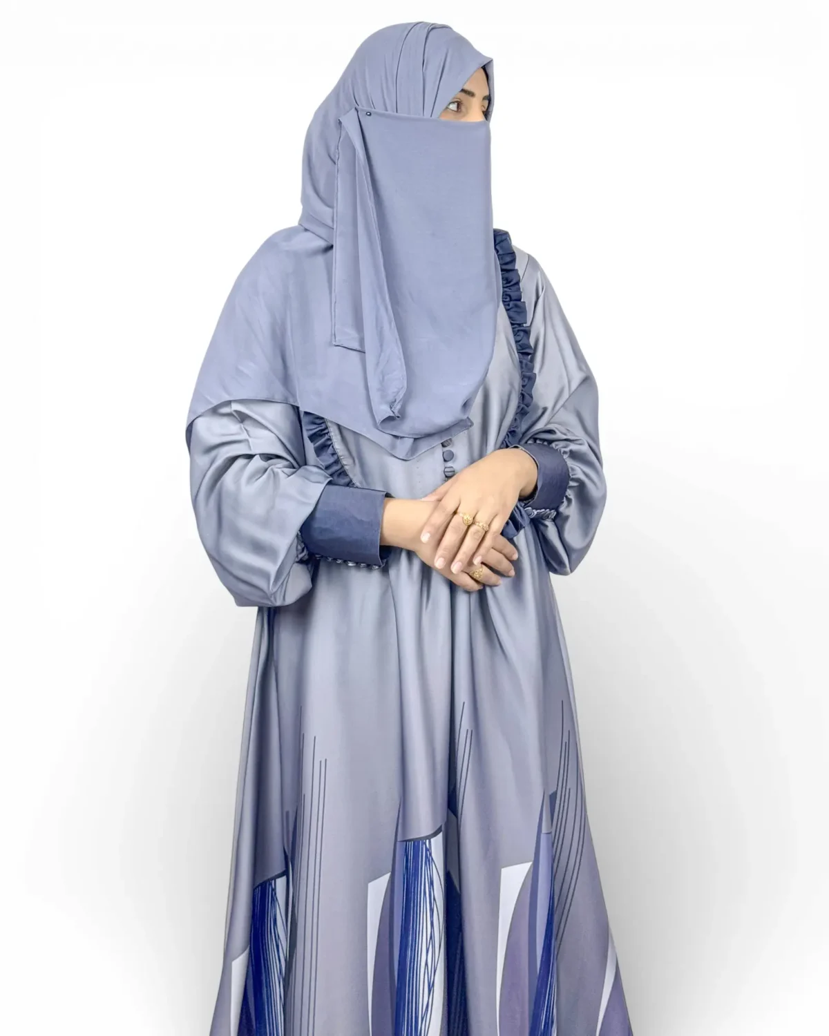 Azure Mist slate-grey abaya front view with ruffle trim on front opening and geometric hem print