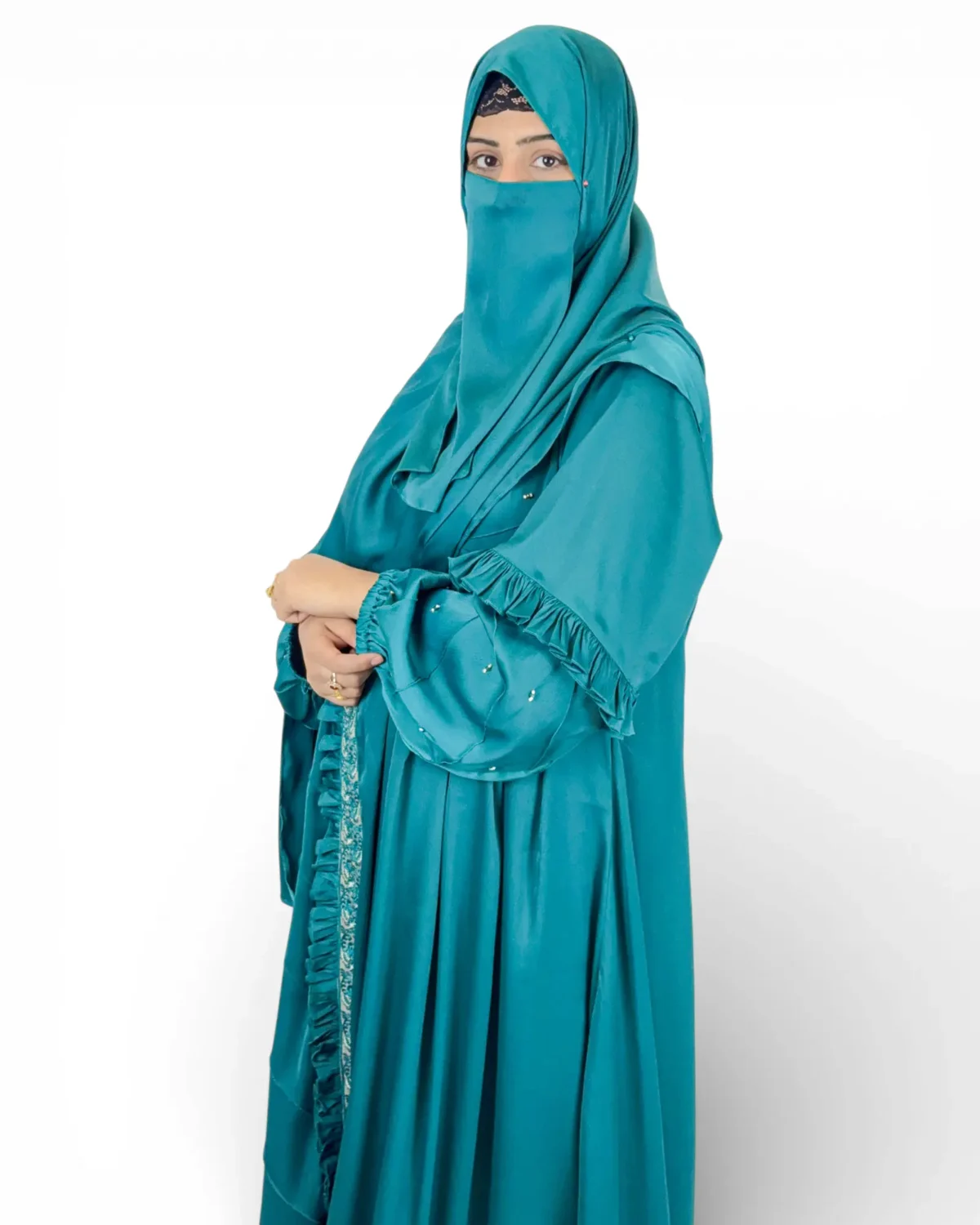 Ocean Lace teal abaya three-quarter view with blouson sleeves and ruffle cuffs