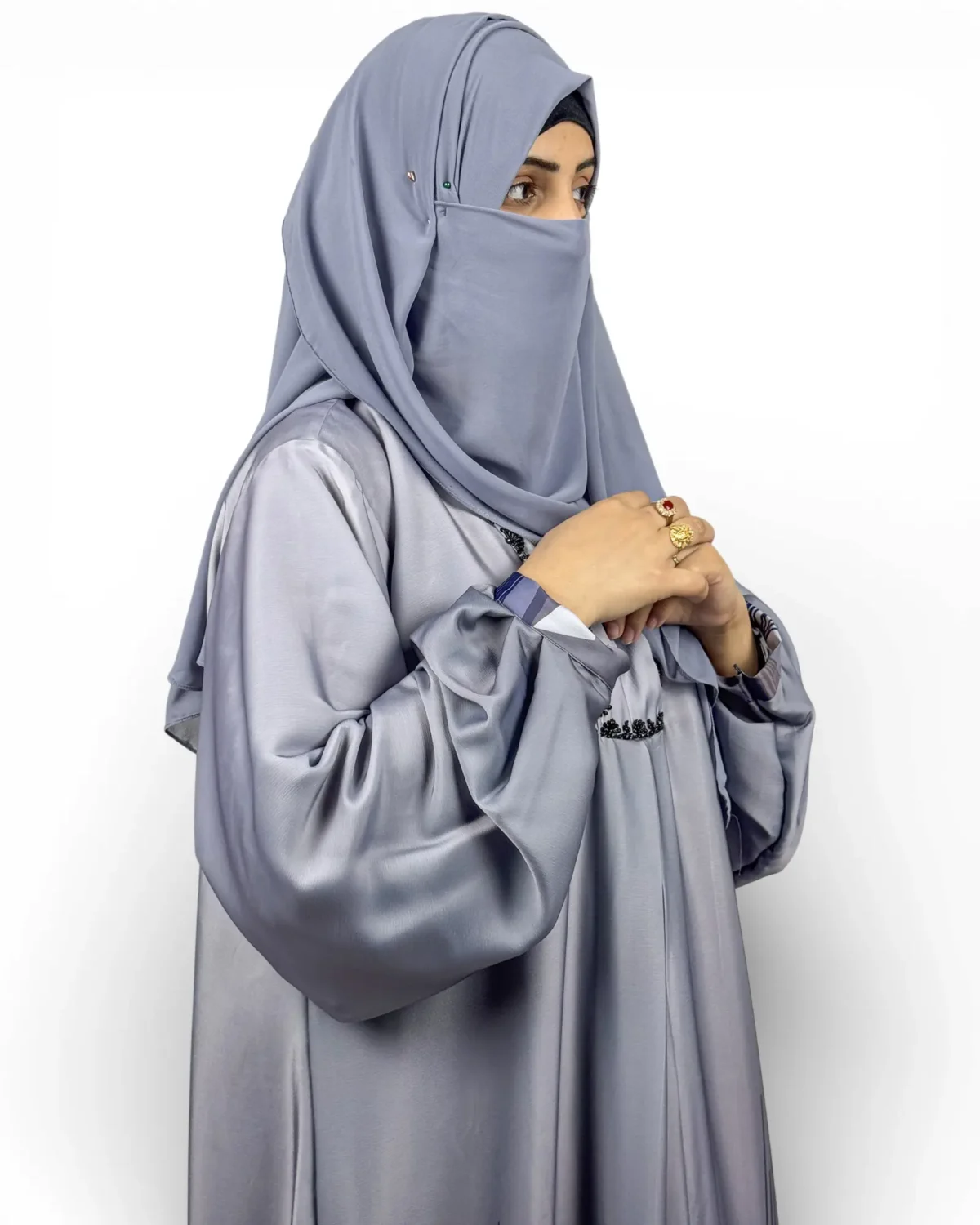 Skyline abaya front view showing angular navy white and grey skyline print at hem