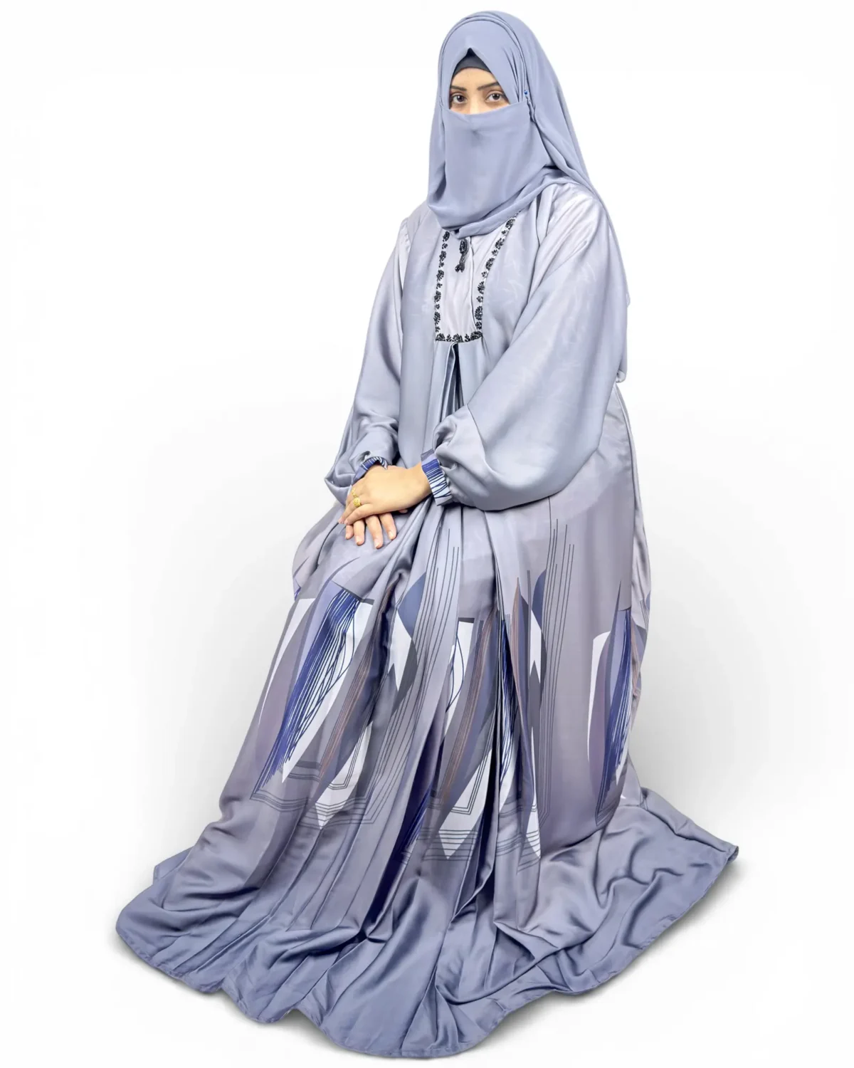 Skyline grey abaya three-quarter view with blue striped printed sleeve cuffs