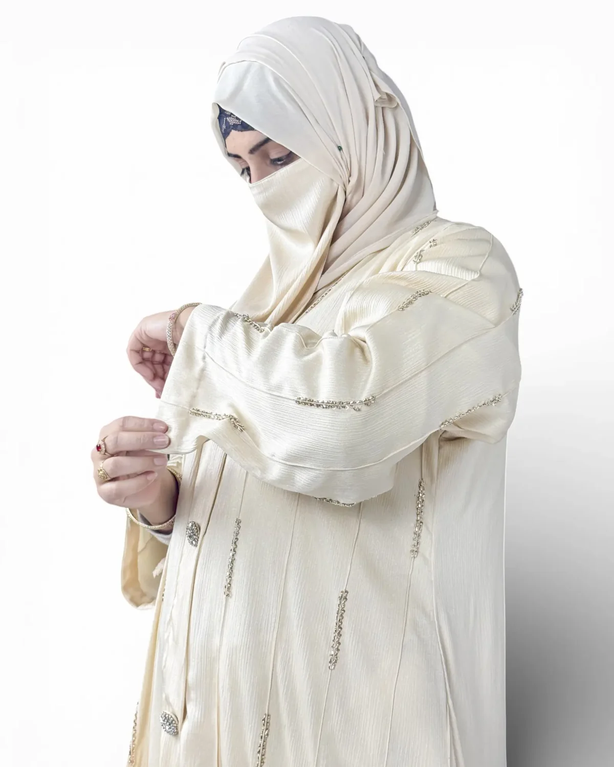 Royal Ivory ivory satin abaya side view showing pintuck stripe texture throughout