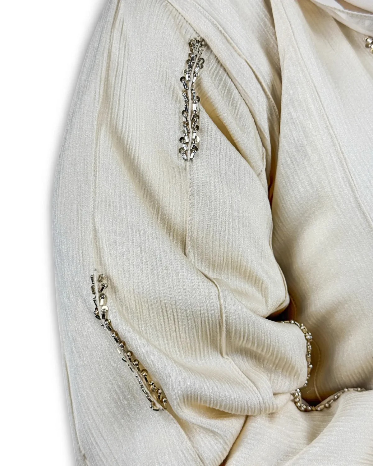 Royal Ivory cream abaya front view with decorative round silver and gold buttons down front
