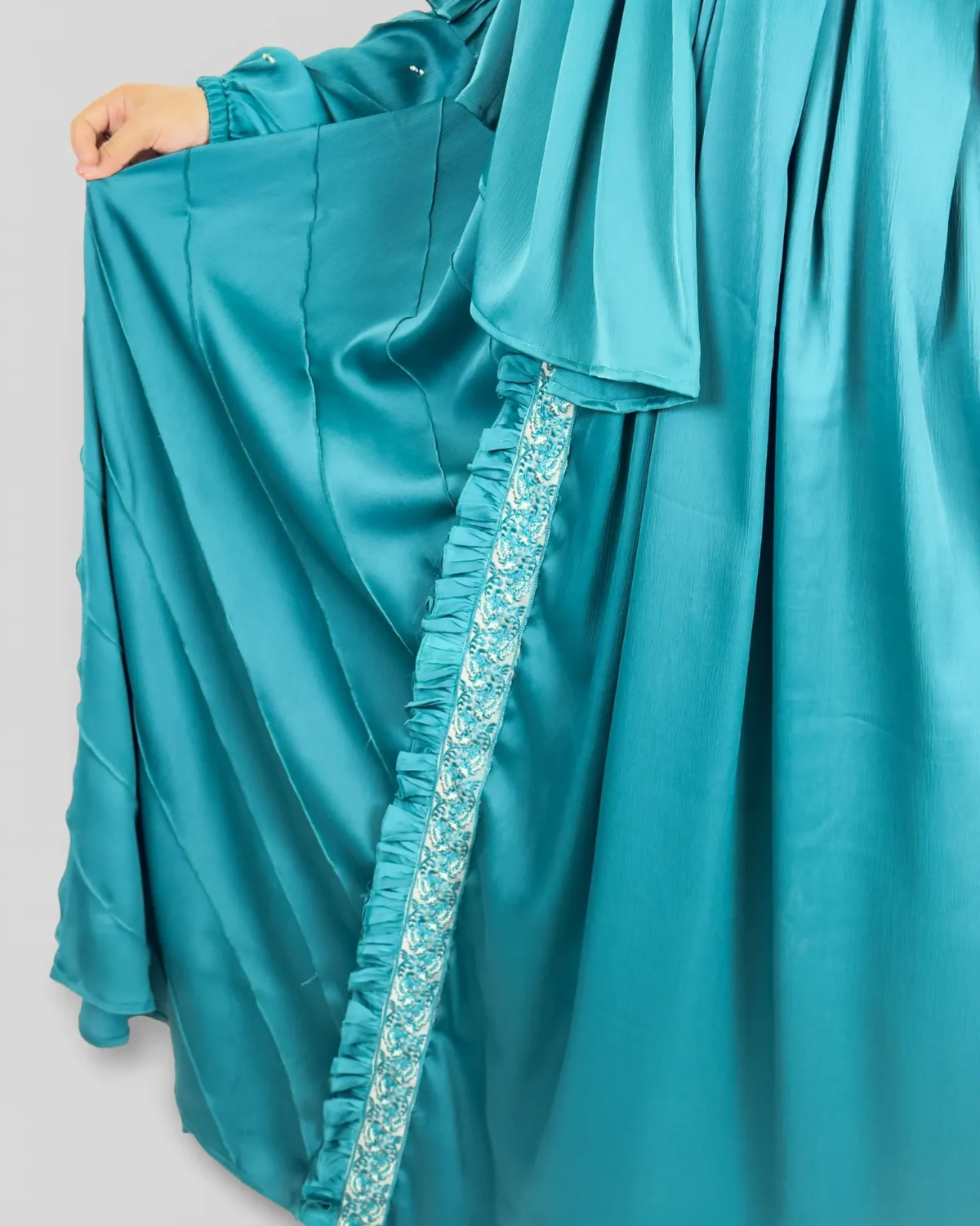 Ocean Lace teal abaya detail of crystal and pearl embellishments on fabric