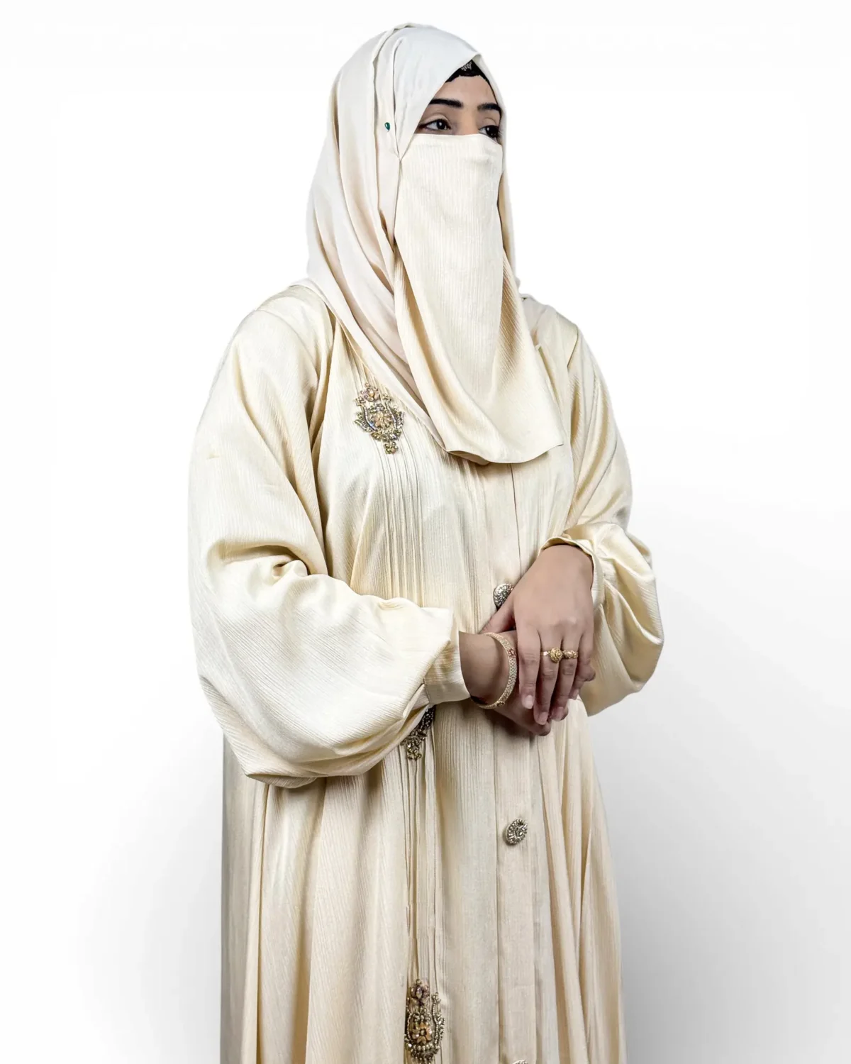 The Vanilla cream abaya side view with balloon sleeves and vertical pintuck texture