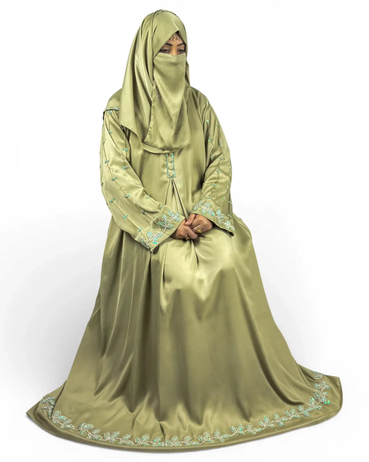 Olive Bloom green abaya close-up of sleeve embroidery featuring scattered turquoise floral motifs