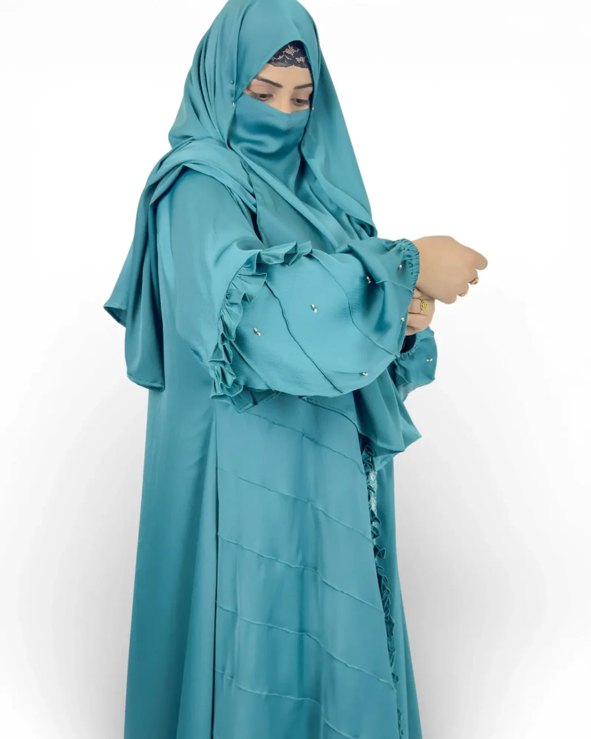 Ocean Lace abaya side view highlighting ruffle cuff sleeves and pintuck stitching