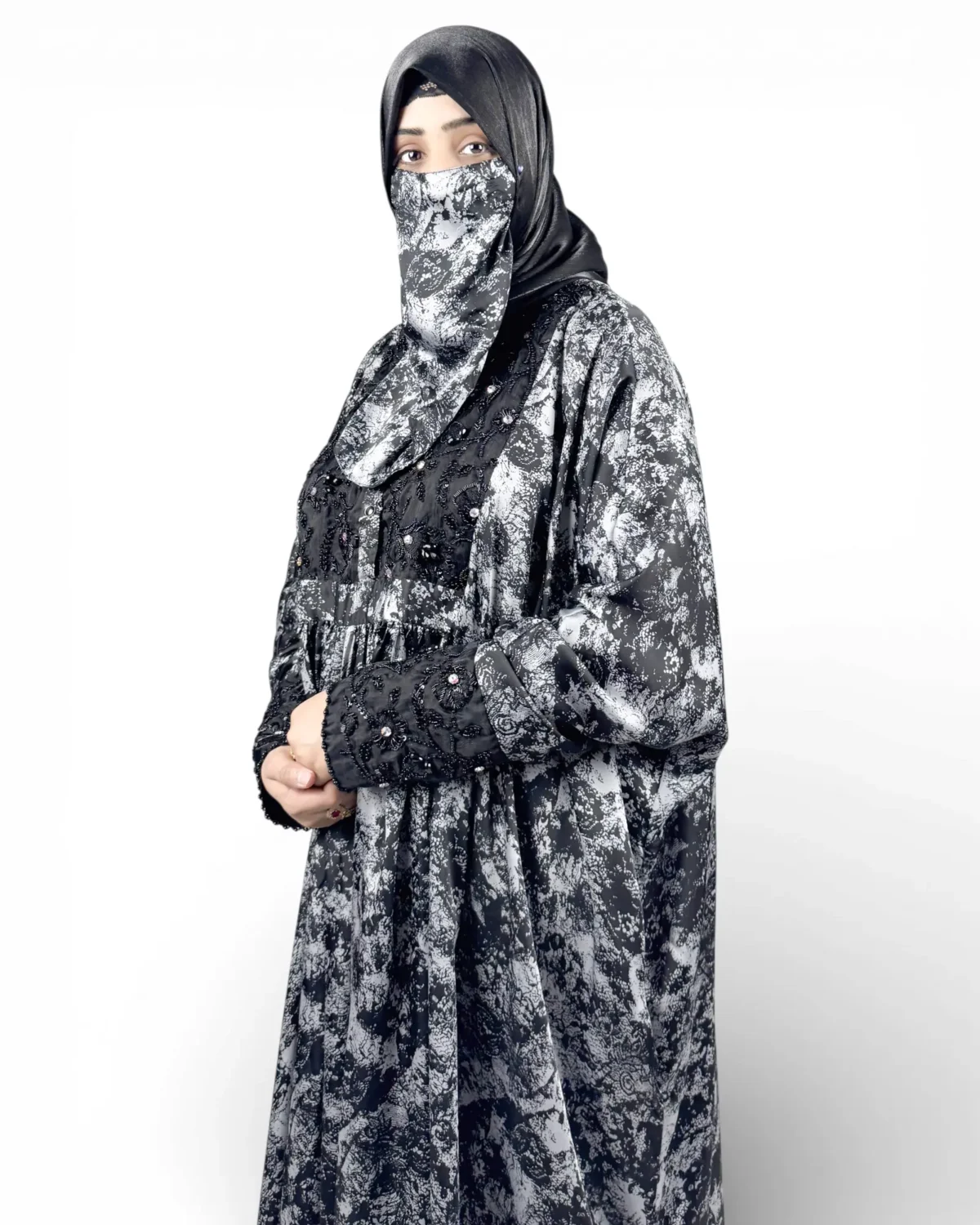 Midnight Snow abaya side view highlighting lace embroidery panel and blouson silhouette