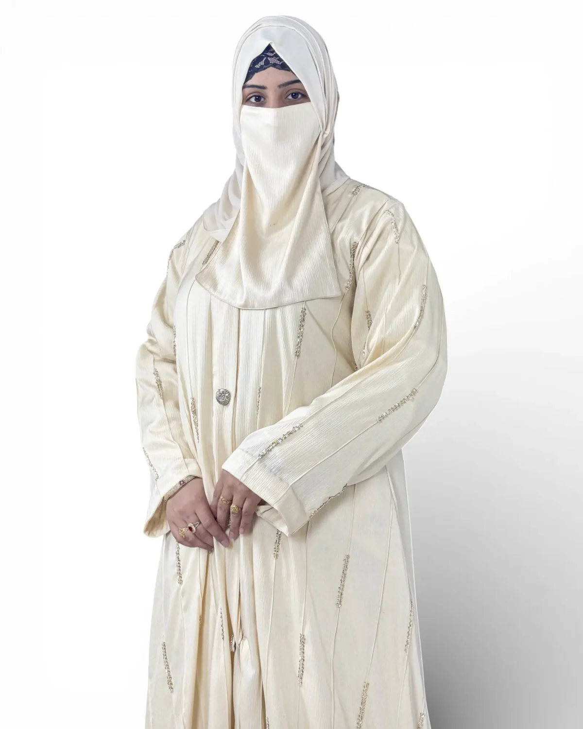 Royal Ivory ivory abaya three-quarter view showcasing pintuck fabric and button detail