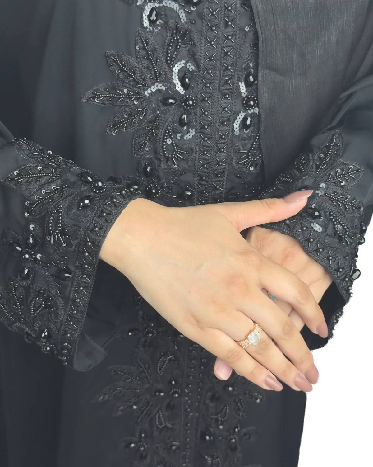 Black Sequin black abaya close-up of the tone-on-tone black beaded floral spray