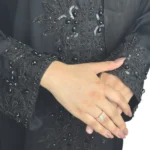 Black Sequin black abaya close-up of the tone-on-tone black beaded floral spray