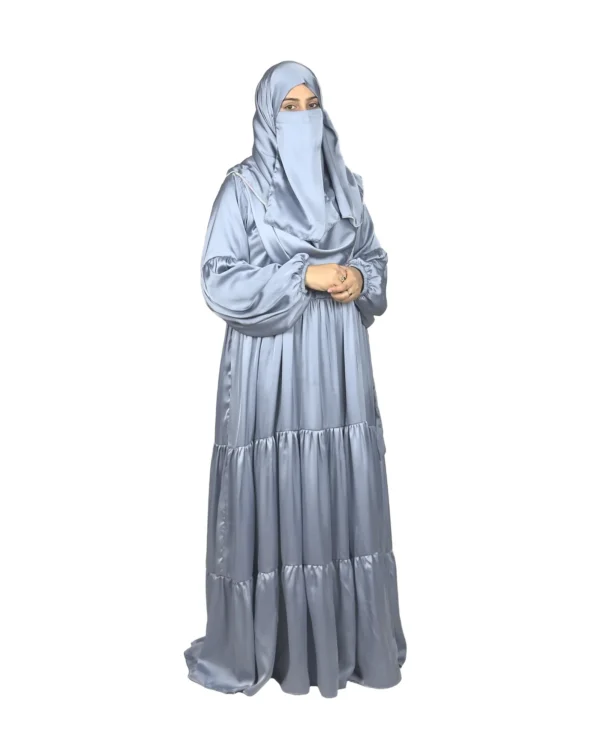 Blue Tiers dusty blue abaya front view with softly tiered high-sheen satin skirt