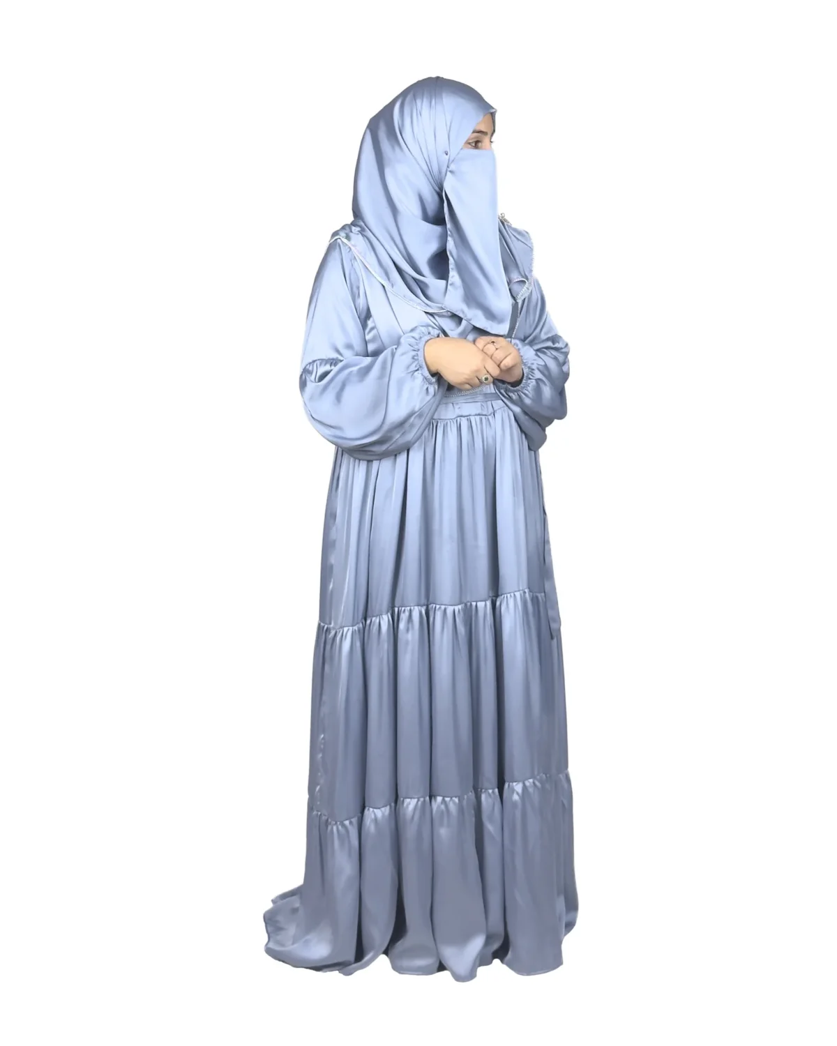 Blue Tiers dusty blue abaya side profile view with softly tiered high-sheen satin skirt