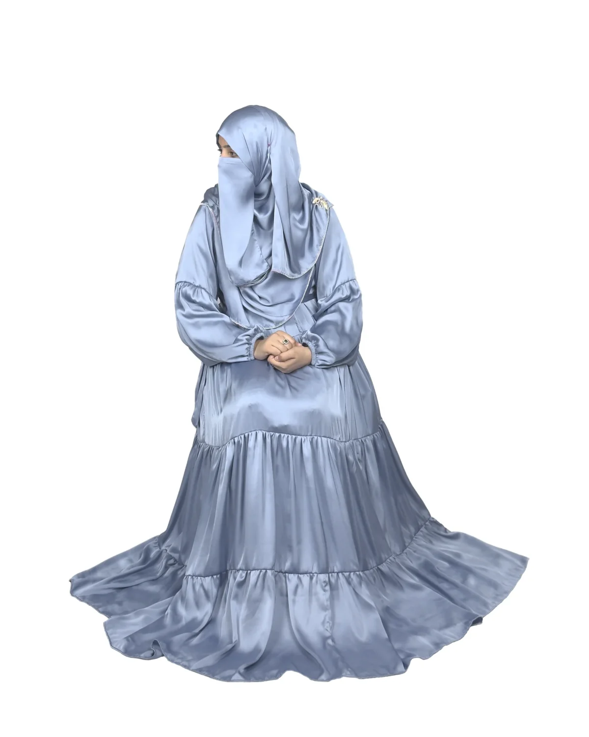 Blue Tiers dusty blue abaya front three-quarter view with softly tiered high-sheen satin skirt