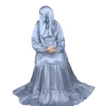 Blue Tiers dusty blue abaya front three-quarter view with softly tiered high-sheen satin skirt