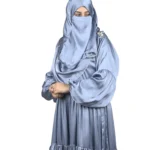 Blue Tiers dusty blue abaya front three-quarter view with softly tiered high-sheen satin skirt