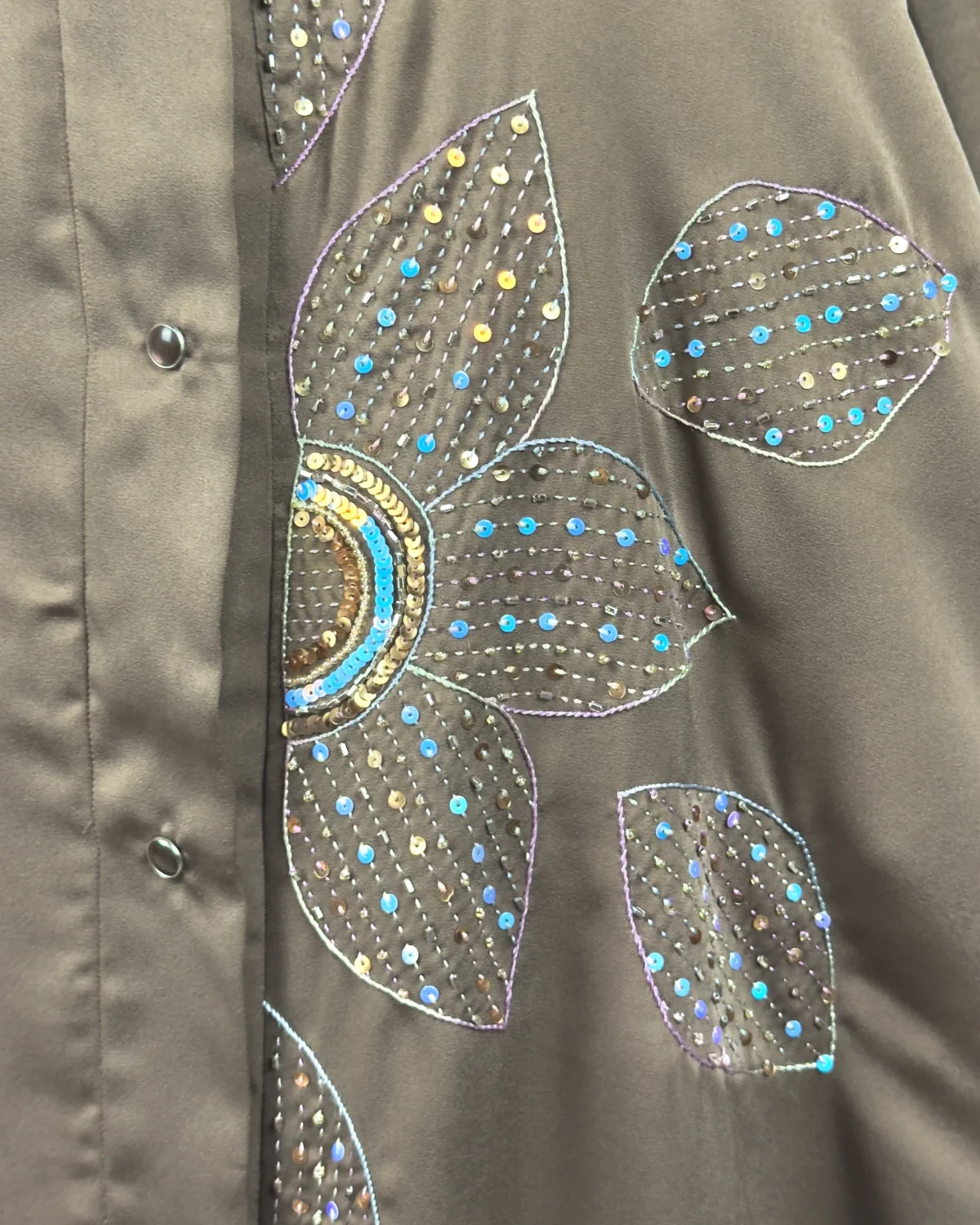 Copper Lily copper / warm dark brown abaya close-up of the oversized sequinned flower appliqué