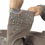 Copper Lily copper / warm dark brown abaya close-up of the sequinned flower petals on the cuff
