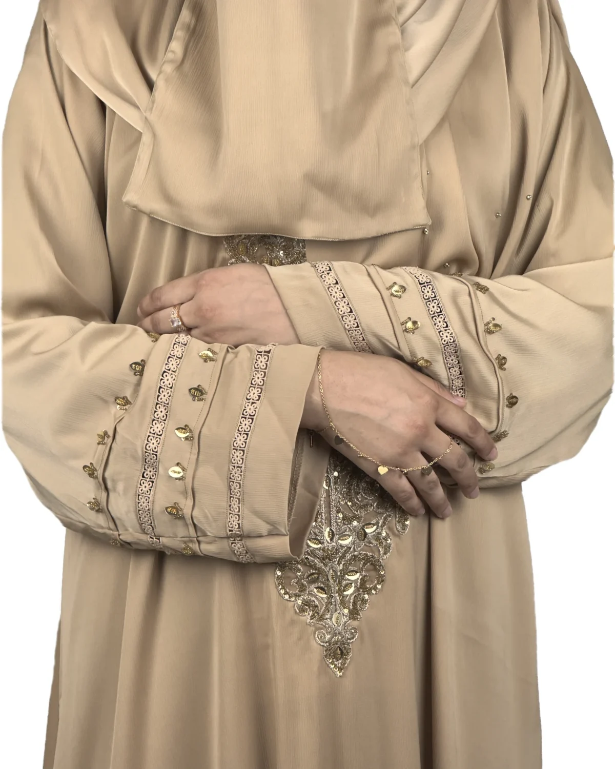 Desert Gold camel / sand beige abaya close-up of the gold-beaded medallion and gold-banded cuff