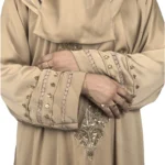 Desert Gold camel / sand beige abaya close-up of the gold-beaded medallion and gold-banded cuff