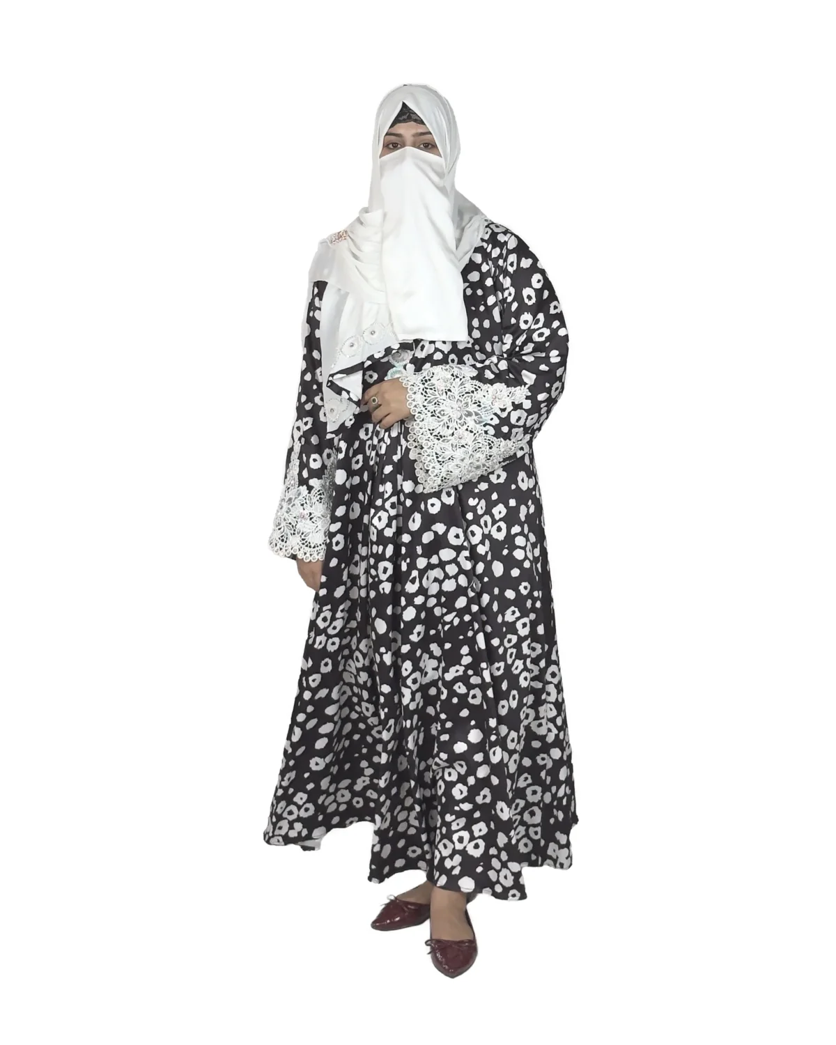 Frost Lace black & white abstract spot print abaya front view with black-and-white spot print with hand-embellished white lace cuffs