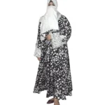 Frost Lace black & white abstract spot print abaya front view with black-and-white spot print with hand-embellished white lace cuffs
