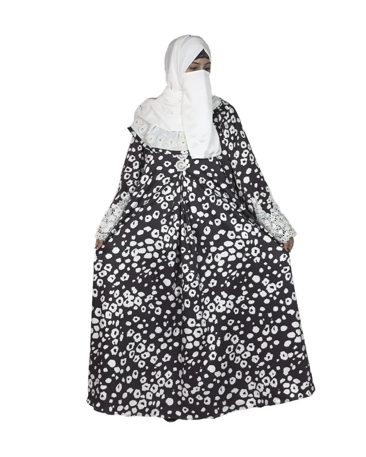 Frost Lace black & white abstract spot print abaya front view with black-and-white spot print with hand-embellished white lace cuffs