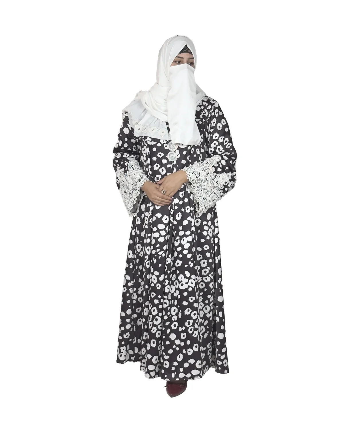 Frost Lace black & white abstract spot print abaya front view with black-and-white spot print with hand-embellished white lace cuffs