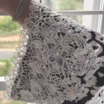 Frost Lace black & white abstract spot print abaya close-up of the white guipure lace cuff