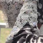 Frost Lace black & white abstract spot print abaya close-up of the sequins and stones hand-placed on the lace cuff