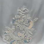 Marble Peacock black & white marble print with a white satin underlay abaya close-up of the hand-beaded paisley-floral appliqué