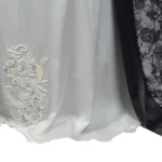 Marble Peacock black & white marble print with a white satin underlay abaya close-up of the beaded appliqué and sweeping train