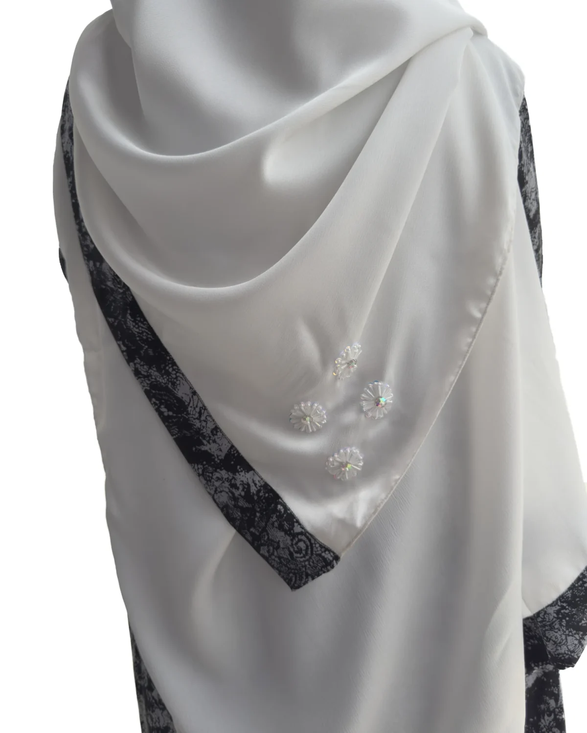 Marble Peacock black & white marble print with a white satin underlay abaya close-up of the beaded rosettes on the matching scarf