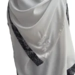 Marble Peacock black & white marble print with a white satin underlay abaya close-up of the beaded rosettes on the matching scarf