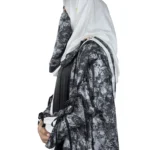 Marble Peacock black & white marble print with a white satin underlay abaya side profile view with marble-print open coat over a white satin slip