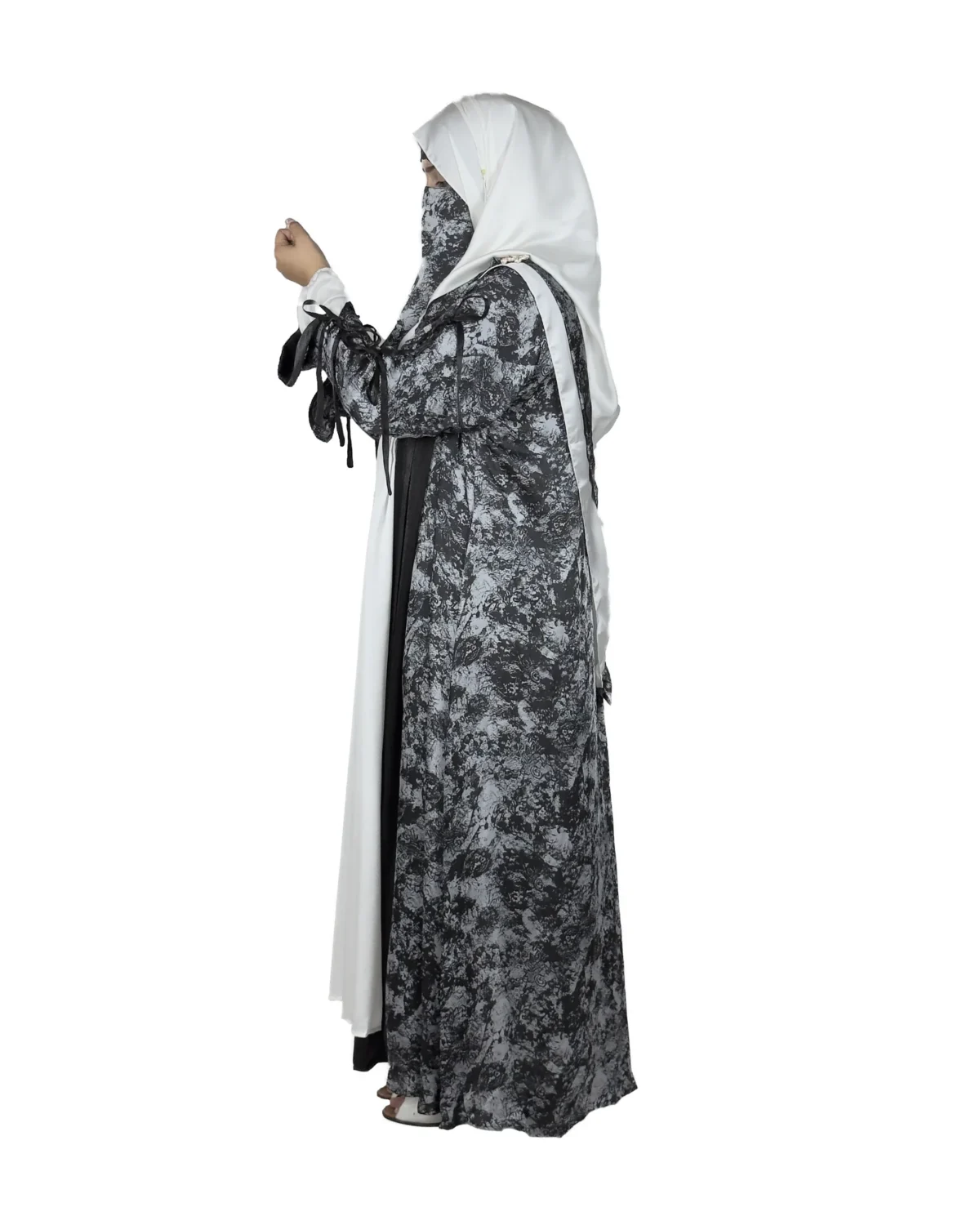 Marble Peacock black & white marble print with a white satin underlay abaya side profile view with marble-print open coat over a white satin slip