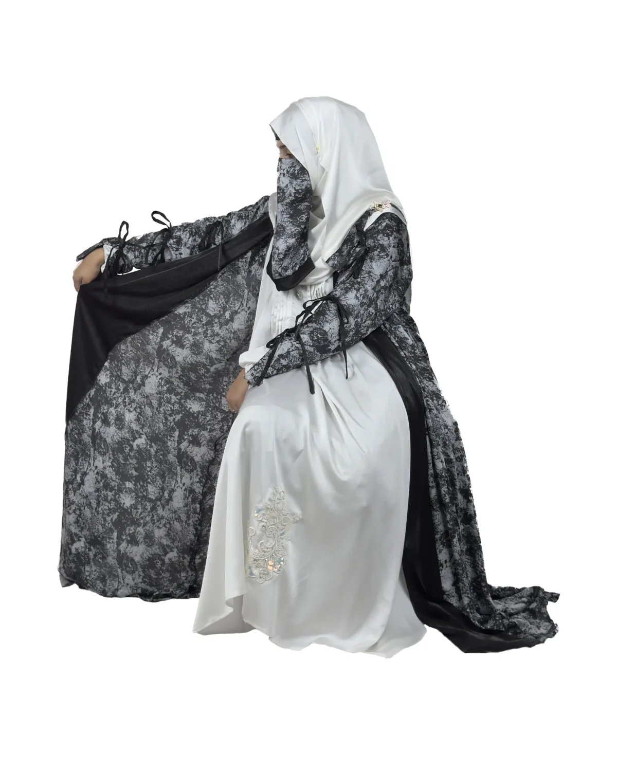 Marble Peacock black & white marble print with a white satin underlay abaya front three-quarter view with marble-print open coat over a white satin slip