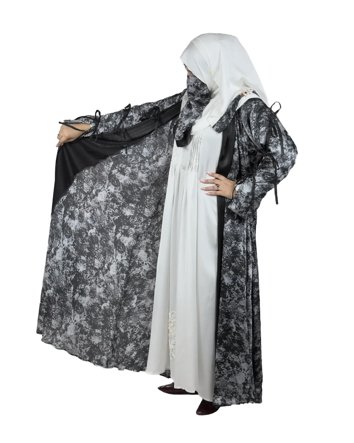 Marble Peacock black & white marble print with a white satin underlay abaya front three-quarter view with marble-print open coat over a white satin slip