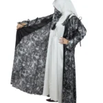 Marble Peacock black & white marble print with a white satin underlay abaya front three-quarter view with marble-print open coat over a white satin slip