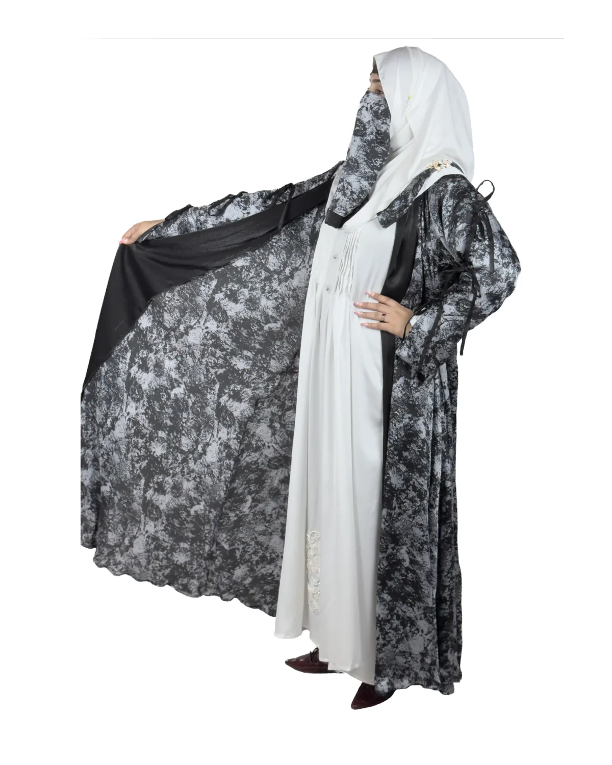 Marble Peacock black & white marble print with a white satin underlay abaya front three-quarter view with marble-print open coat over a white satin slip